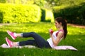 Sportive young woman stretching with dumbbells, doing fitness Royalty Free Stock Photo