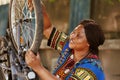 Sportloving woman securing bicycle wheel