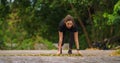 Sportman runner practicing sprinting run on road in park in morning