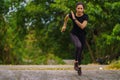 Sportman runner practicing sprinting run on road in park in morning