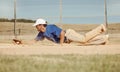 Sports, action and a man catching baseball, sliding in dust on floor with ball in baseball glove. Slide, dive and catch Royalty Free Stock Photo