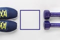 Sports and active lifestyle concept. Purple running shoes and two dumbbells on white background. Flat lay. Top view