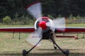 Sports airplane with running motor on an airfield