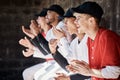 Sports applause, baseball winner or team in celebration of game success in fun victory, competition or goals dugout Royalty Free Stock Photo