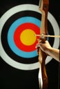 Sports archer preparing to fire