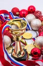 Sports awards and new year`s toys, medals and cups, red Christmas balls, winter competitions, new year`s holidays