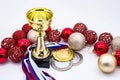 Sports awards and new year`s toys, medals and cups, red Christmas balls, winter competitions, new year`s holidays