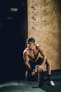 Handsome weightlifter preparing for training with barbell Royalty Free Stock Photo