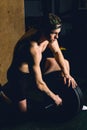 Handsome weightlifter preparing for training with barbell Royalty Free Stock Photo