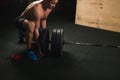 Handsome weightlifter preparing for training with barbell Royalty Free Stock Photo