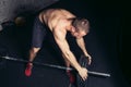 Man lifting weights. muscular man workout in gym doing exercises with barbell Royalty Free Stock Photo