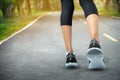 Sports background, Runner feet running on road closeup on shoe, Sport woman running on road at sunrise, Fitness and workout Royalty Free Stock Photo