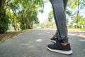 Sports background, Runner feet running on road closeup on shoe, Sport woman running on road at sunrise, Fitness and workout Royalty Free Stock Photo