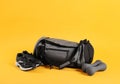 Sports bag and gym equipment on yellow background Royalty Free Stock Photo