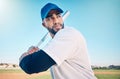 Sports, baseball and man with bat on field ready for hitting ball in game, practice and competition. Fitness, motivation Royalty Free Stock Photo