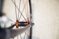Sports bicycle front axle with quick disconnect wheels