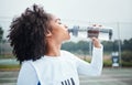 Sports, black woman and drinking water at court during training, workout and sport exercise outdoors. Fitness, thirsty Royalty Free Stock Photo