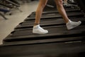 Sports blonde women on running track. female athlete on treadmill