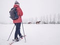 Sports body woman walk quickly with red hobby snowshoes