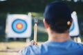 Sports, bullseye and man with axe for target on range for training, exercise and hunting competition. Extreme sport Royalty Free Stock Photo