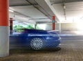 Sports car blur in garage Royalty Free Stock Photo