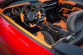 Sports car interior with orange accents. Royalty Free Stock Photo