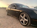 Sunset refleting on black sports car