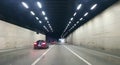 Sports car speeding through a tunnel in the city