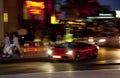 A sports car sweeps along a night street, Dubai 2013