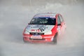 Sports car turns into a skid on the icy track