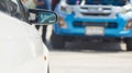 Sports car and Used cars, parked in the parking lot of Dealership waiting to be sold and delivered to customers and waiting for Royalty Free Stock Photo