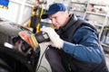 Sports car in a workshop Royalty Free Stock Photo