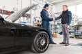 Sports car in a workshop Royalty Free Stock Photo