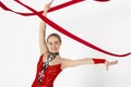 Sports competition. Lovely girl with string practicing rhythmic gymnastics on white background