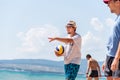 Young fit caucasian men playing beach volleyball in a team Royalty Free Stock Photo