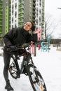 Sports concept, young woman riding a sports bike in winter Royalty Free Stock Photo