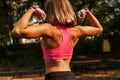 Sports Confident Girl Trains On A Sports Ground, Sporty Woman From The Back Flexing Her Biceps