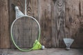 Sports equipment for bambinton on vinage wood background. Royalty Free Stock Photo