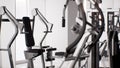 Sports equipment in empty modern gym interior 3d render, heavy gym equipment, modern fitness club Royalty Free Stock Photo