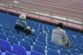 Sports fans in stadium seats