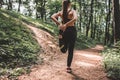 Sports female doing stretching legs before running outdoors. Royalty Free Stock Photo