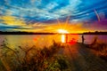 Sports Fishermen at Sunset early fall with beautiful skyline over Ed Zorinsky lake Omaha Nebraska