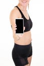 Sports fit woman holding smart phone with empty blank screen to copy paste Mobile phone program for sport Royalty Free Stock Photo