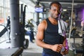 Sports, fitness, healthy lifestyle. African man in the gym. Royalty Free Stock Photo