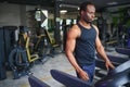 Sports, fitness, healthy lifestyle. African man in the gym. Royalty Free Stock Photo