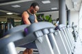 Sports, fitness, healthy lifestyle. African man in the gym. Royalty Free Stock Photo