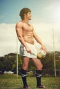 Sports, fitness and rugby man with ball on field for training, wellness and morning cardio outdoor. Handball, exercise