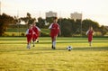 Sports, fitness and soccer training by girl team playing on grass field, teamwork during football game. Health, exercise Royalty Free Stock Photo