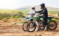 Sports, friends and men with motorcycle in countryside for fun, hobby and stunt training, practice or freedom. Off road