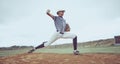 Sports game, baseball field and man throw ball in competition, practice match or pitcher training workout. Softball Royalty Free Stock Photo